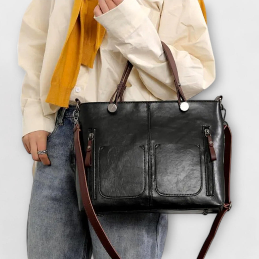 Cortona black vintage tote carried on the shoulder