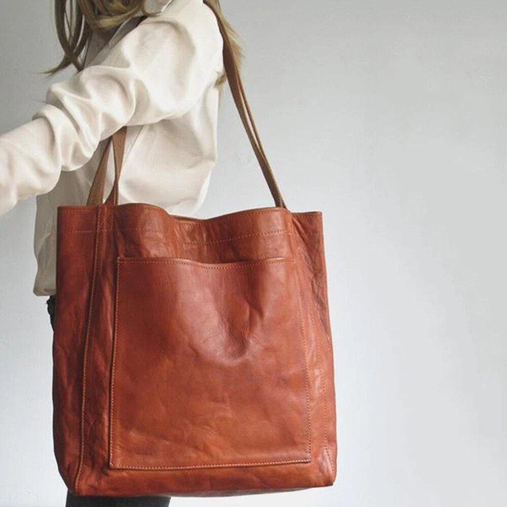 Enna cognac leather-look shoulder tote worn over the shoulder