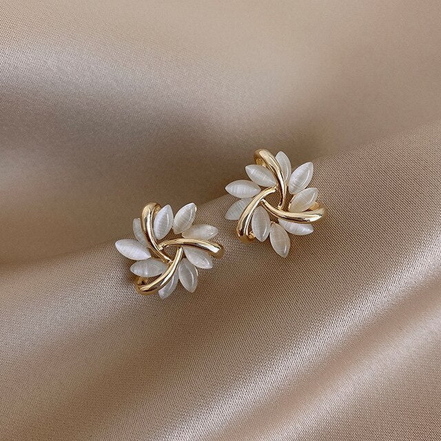 Elegant Breeze Opal Earrings featuring a delicate floral design, showcasing shimmering opal stones set in high-quality metal for a sophisticated look. - 1