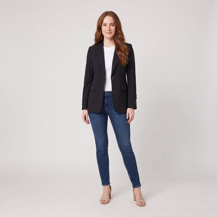 Woman wearing a black classic tailored blazer, front view