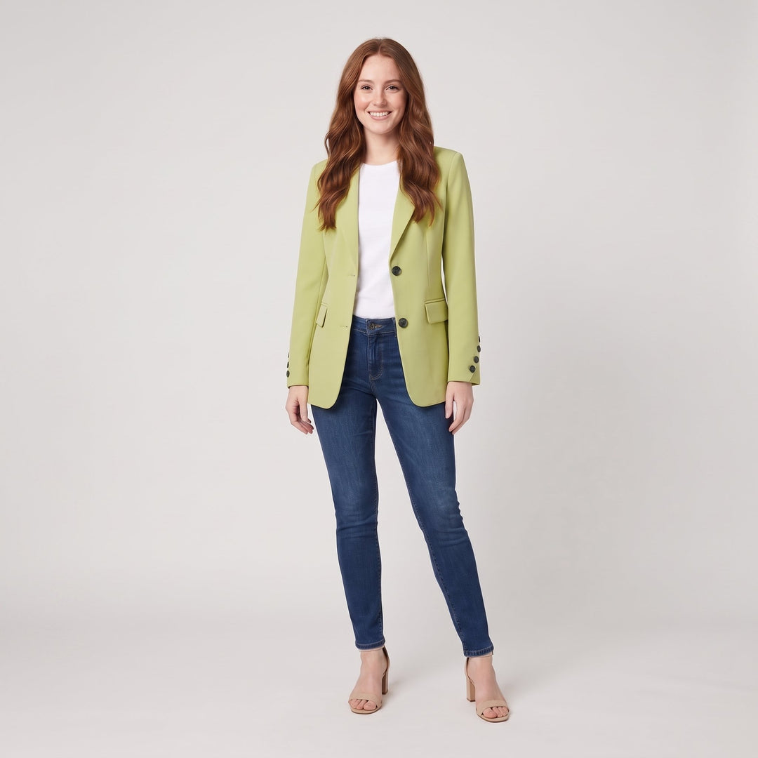Woman wearing a light green classic tailored blazer, front view