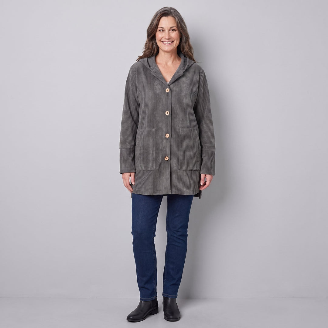 Woman wearing a grey corduroy hooded jacket, front view