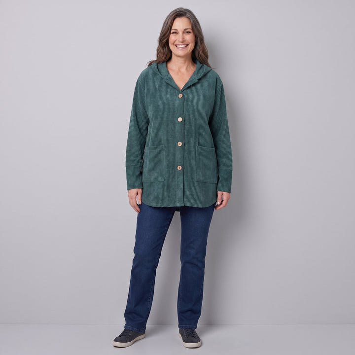 Woman wearing a teal green corduroy hooded jacket, front view