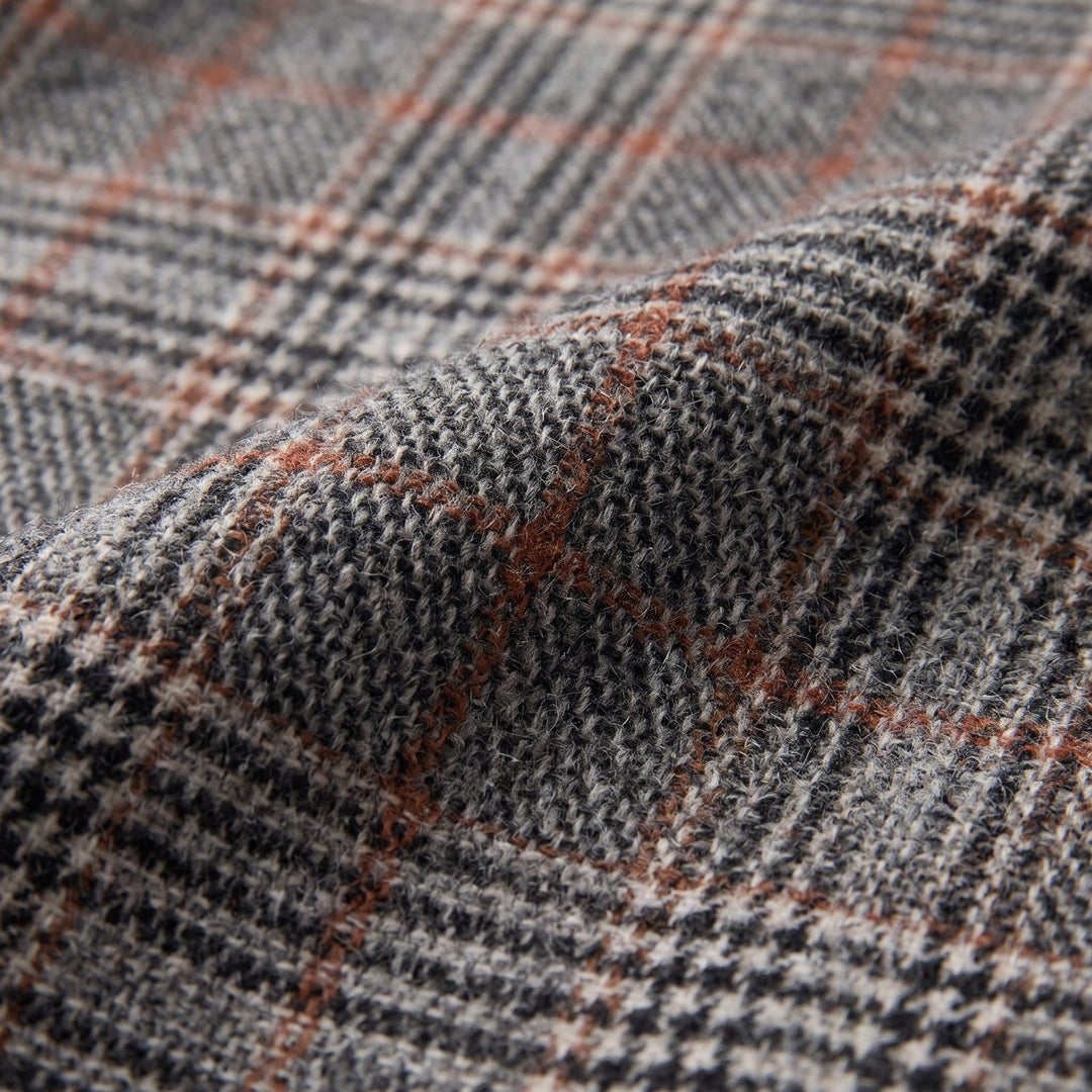 Close-up of the glen-check wool with brown overcheck