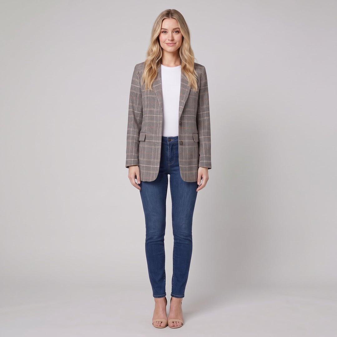 Woman wearing a grey glen-check blazer with brown overcheck, front view