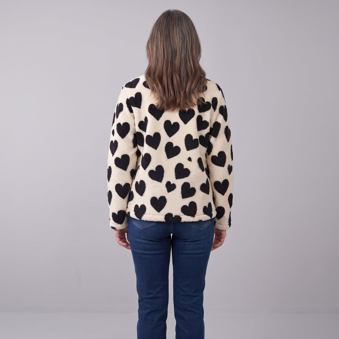 Back view of the cream sherpa jacket with black hearts