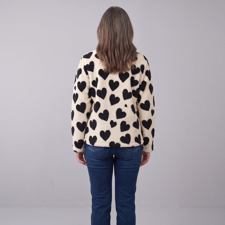 Back view of the cream sherpa jacket with black hearts