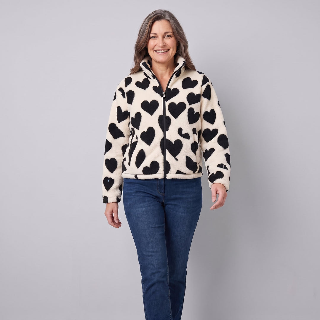 Cream sherpa heart jacket in a walking pose