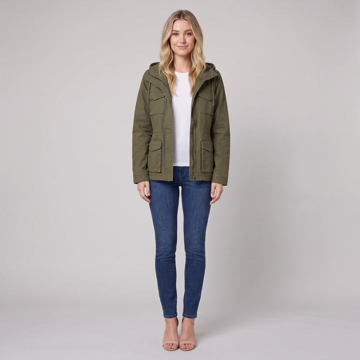 Woman wearing an olive green canvas hooded field jacket, front view