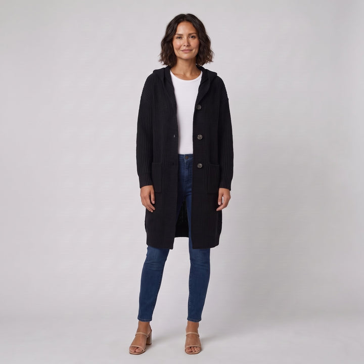Woman wearing a black hooded knit cardigan-coat, front view