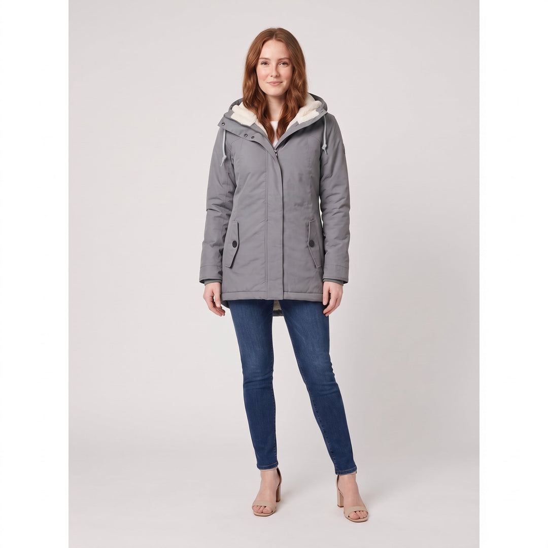 Woman wearing a grey fleece-lined hooded parka, front view