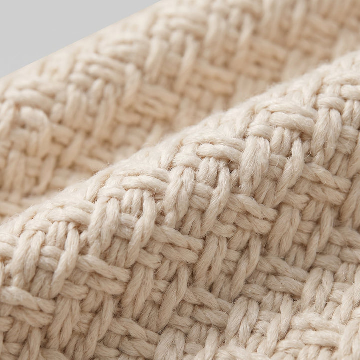 Close-up of the beige woven jacket fabric