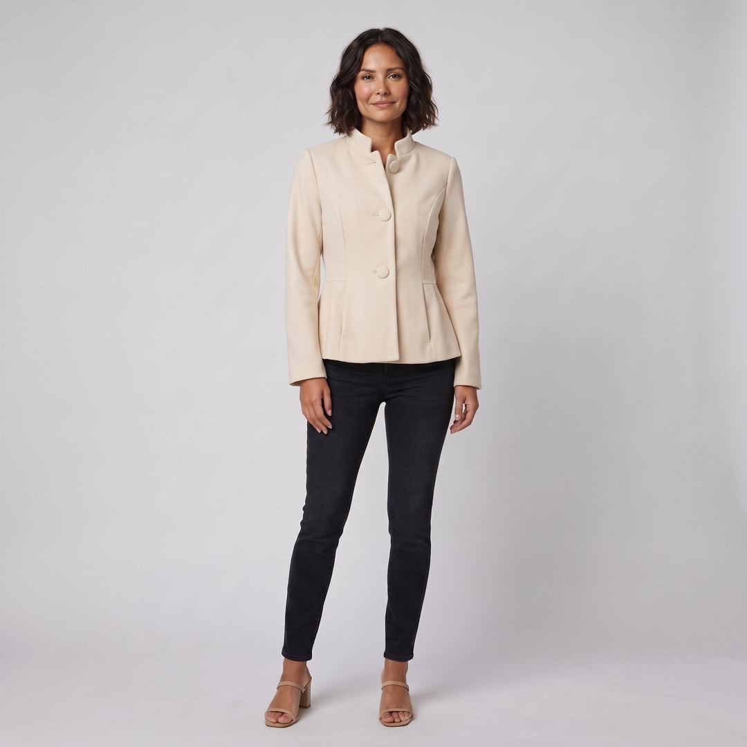 Woman wearing a cream-beige stand-collar tailored jacket, front view