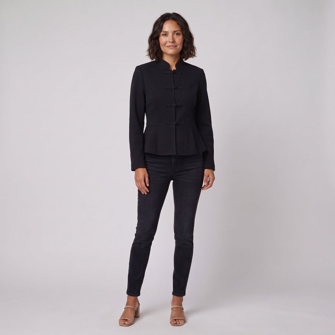 Woman wearing a black stand-collar tailored jacket, front view
