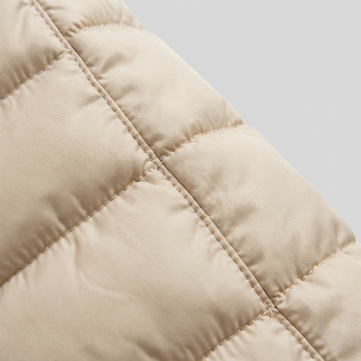 Lady winter coat quilted fabric close-up