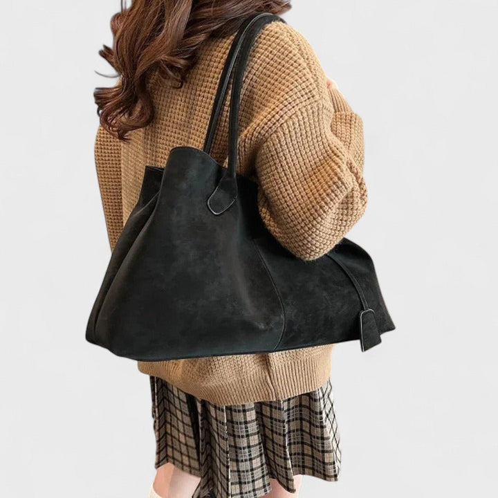 Roux slouchy black shoulder tote worn over the shoulder