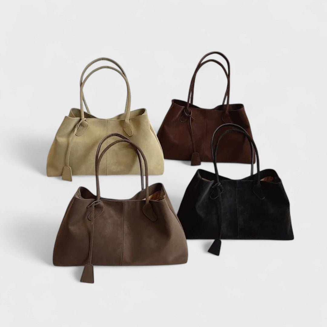 Roux shoulder tote, strap and tab closure detail