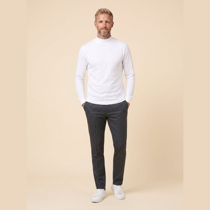 Maverick white long sleeve tee front relaxed pose