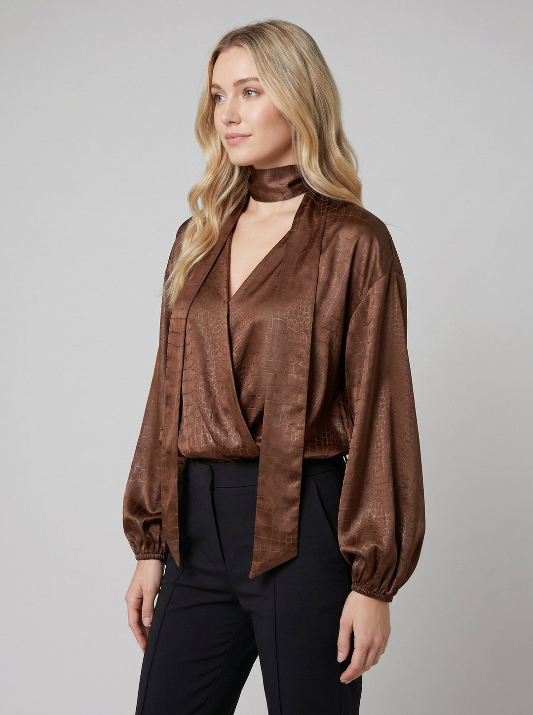 Alexia brown satin blouse angled pose on model