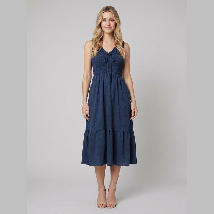 Dark blue A-line midi dress with a V-neck, front view on model