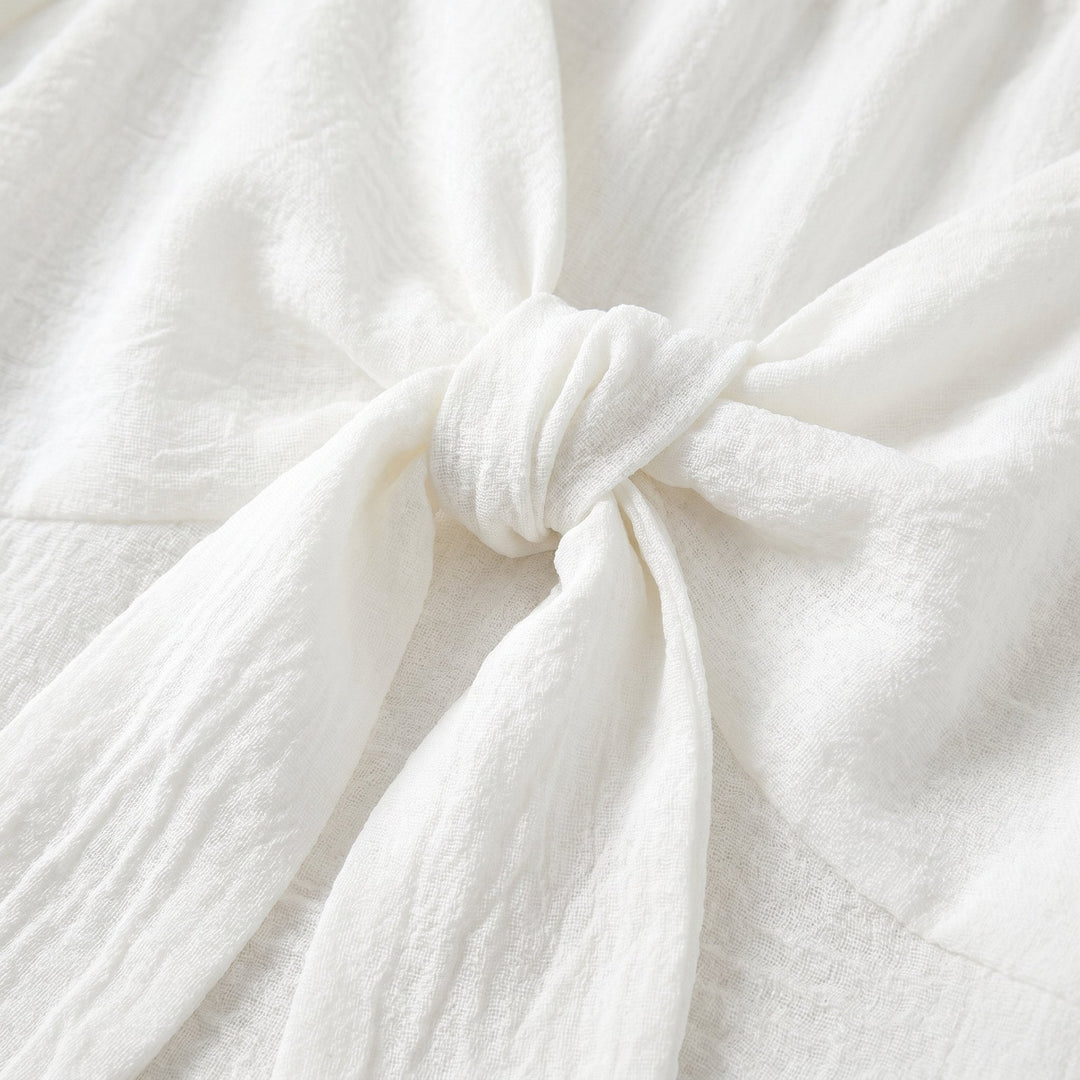 Charline mini dress, textured fabric and bow tie detail