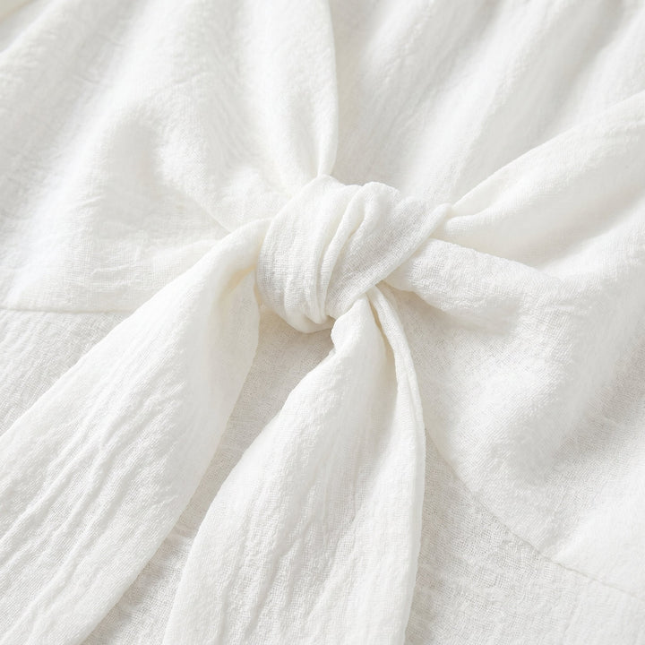 Charline mini dress, textured fabric and bow tie detail