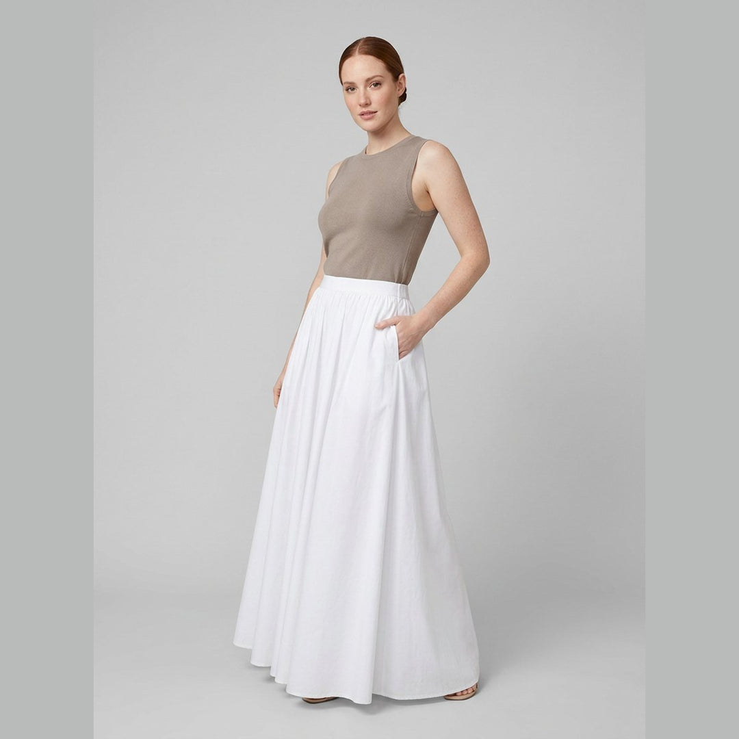 Cora white cotton maxi skirt, three-quarter view on model