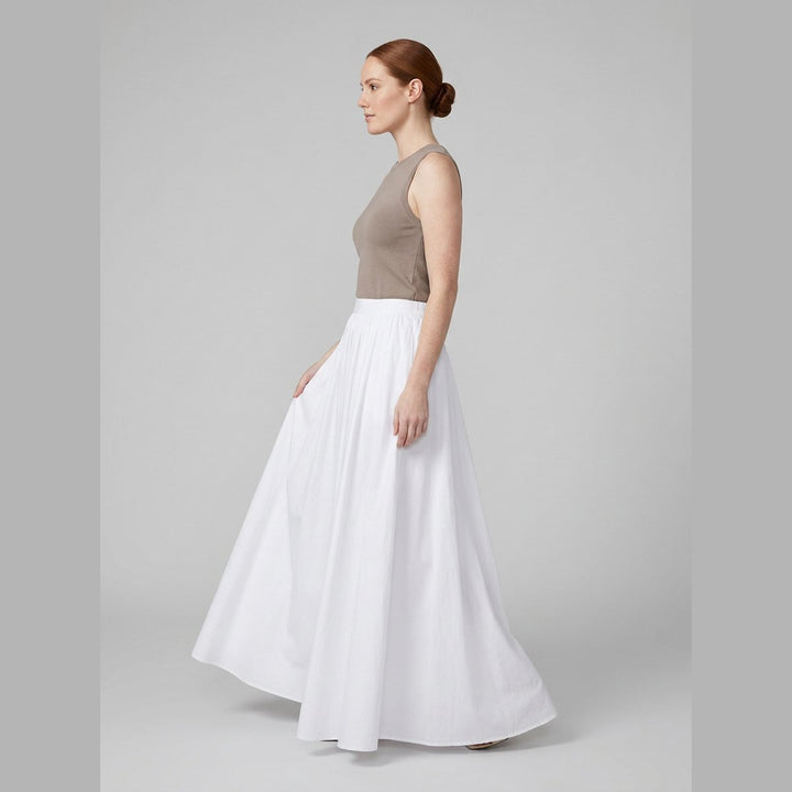 Cora white cotton maxi skirt, side view on model