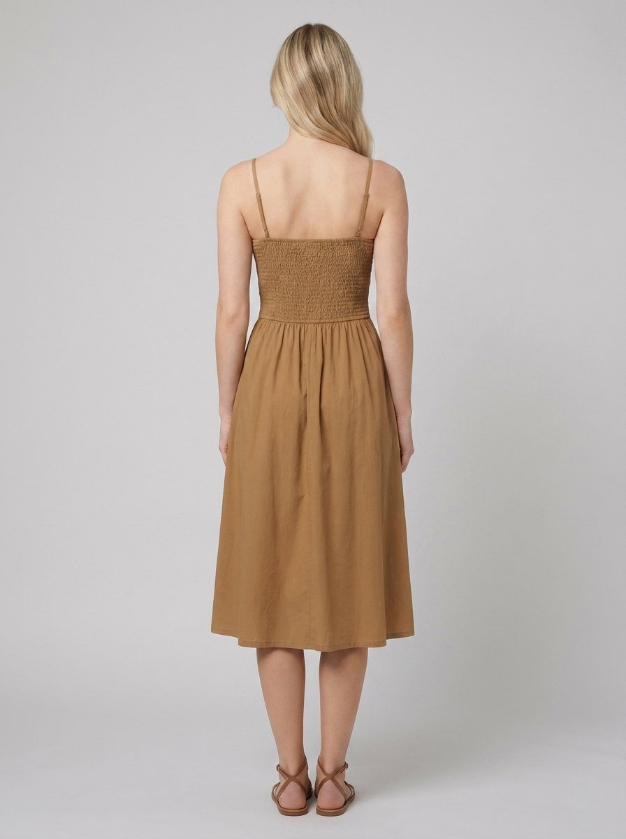Brown A-line midi dress, back view showing the smocked panel
