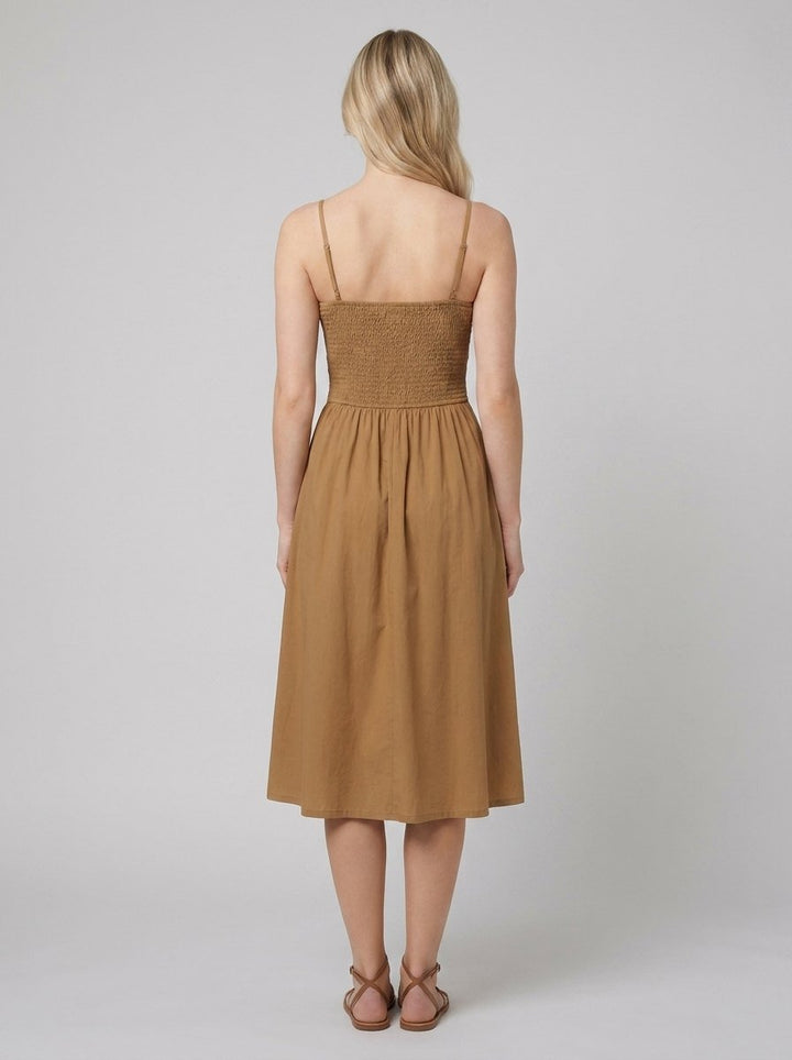 Brown A-line midi dress, back view showing the smocked panel