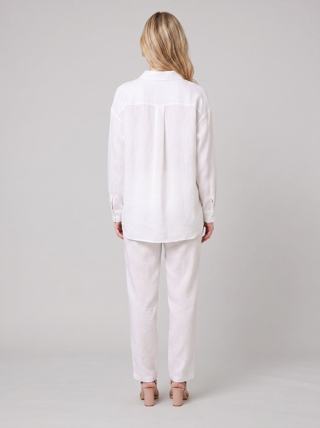 Dani white blouse back view on model