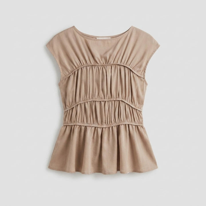 Dashi peplum top product flat lay
