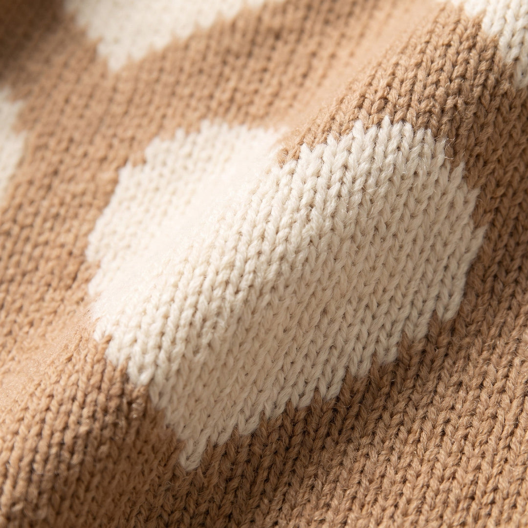 Knitted heart motif and camel knit fabric close-up