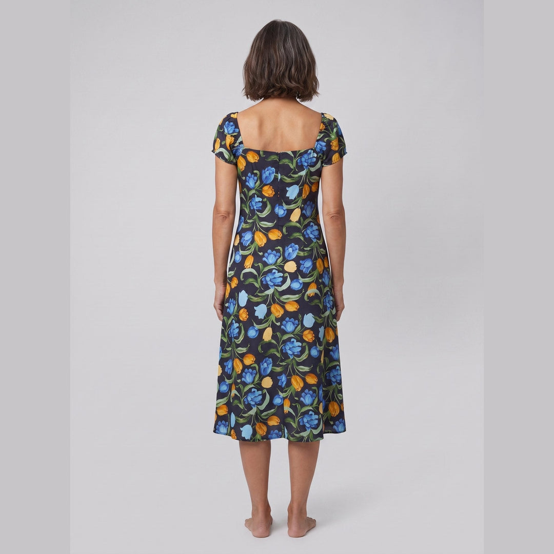 Ivy floral midi dress with square neckline, back view on model