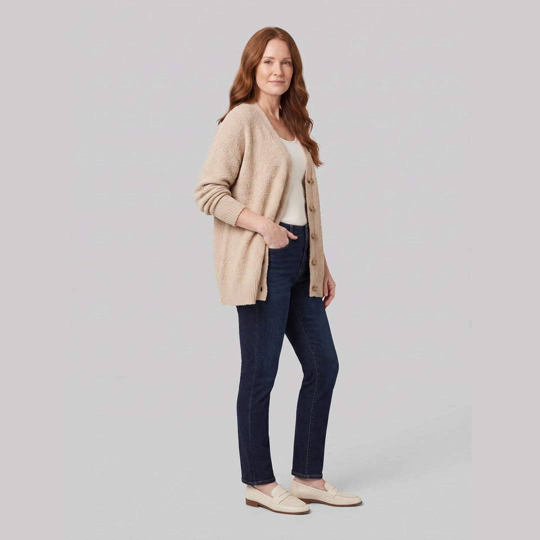 Beige oversized boucle cardigan on model, three-quarter view