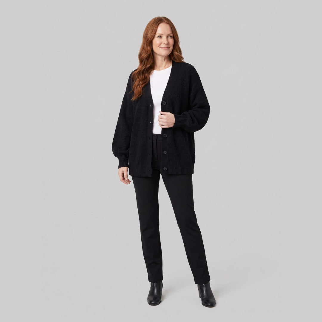 Black oversized boucle cardigan on model, relaxed pose