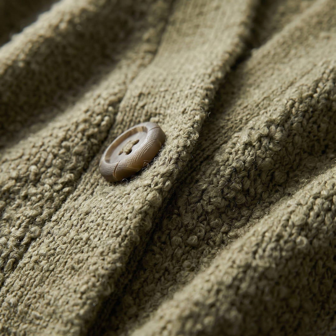 Boucle knit fabric and button placket close-up