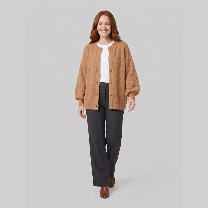 Light brown oversized boucle cardigan on model, walking pose