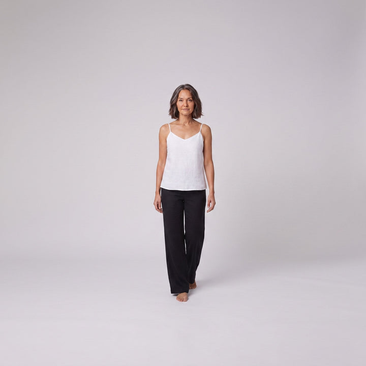 Jess V-neck linen camisole top in white, relaxed front pose on model