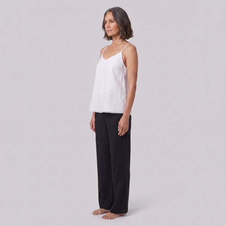 Jess V-neck linen camisole top in white, side view on model