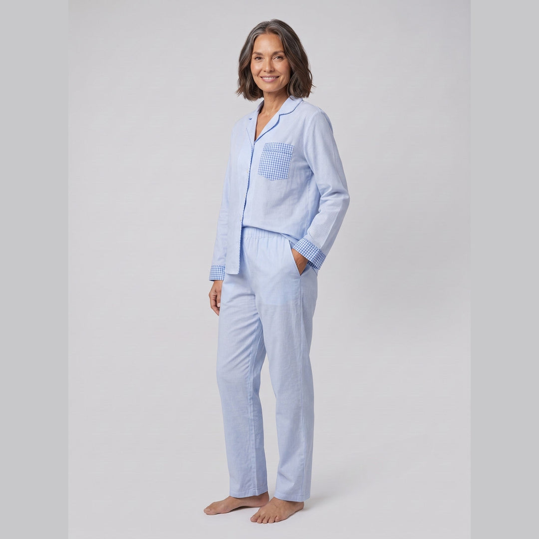 Light blue pinstripe pyjama set on model, three-quarter view