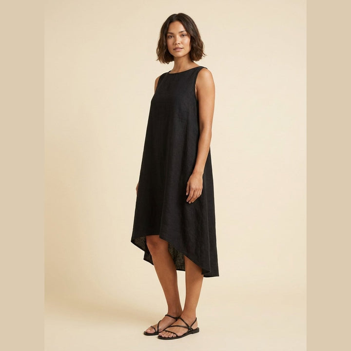 Black linen dress with a high-low hem, side view on model