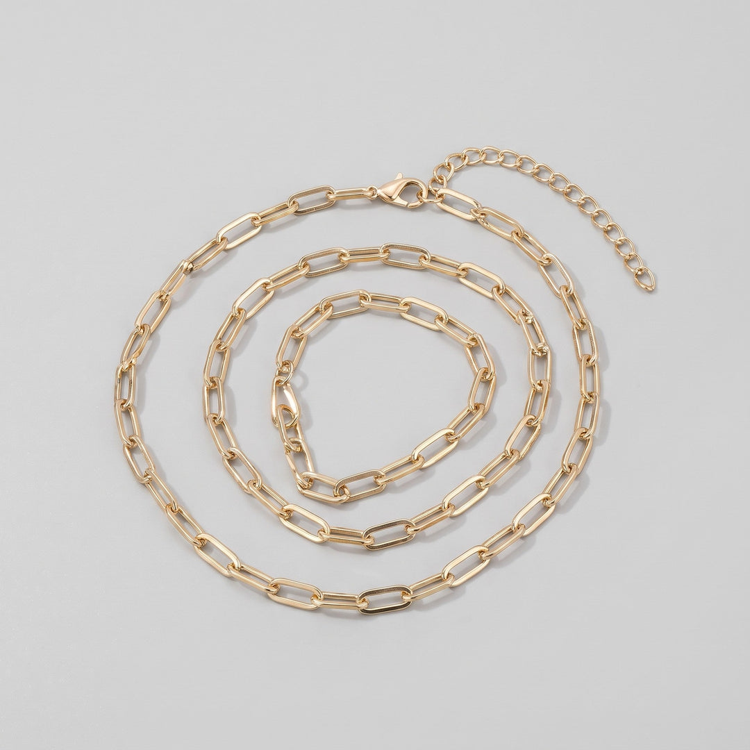Gold body chain coiled, showing full length