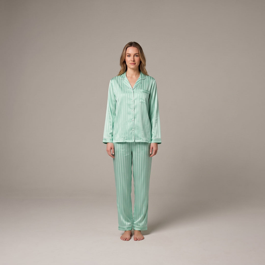 Luxe satin pajama set in sage green, front view on model