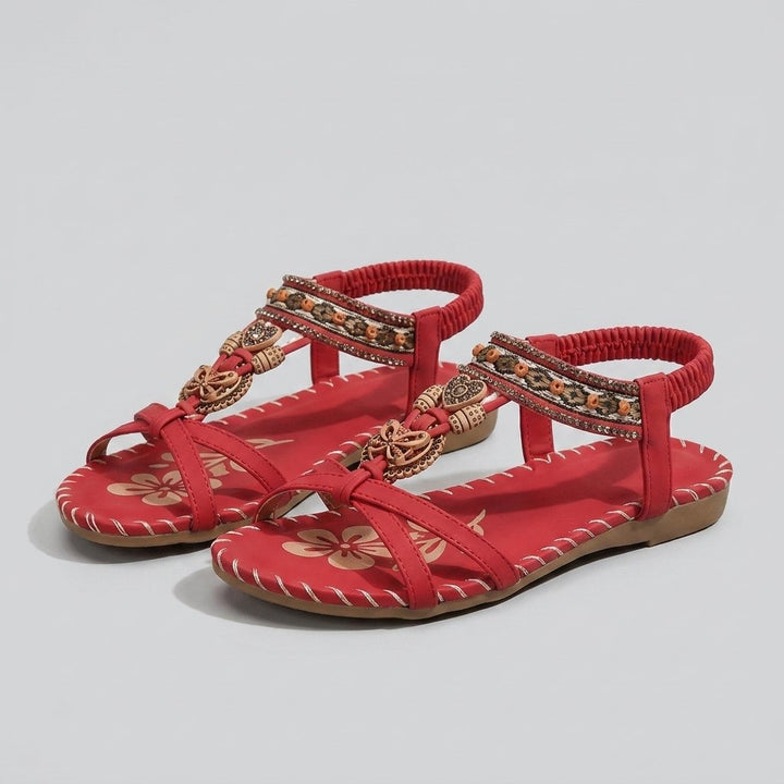 Red beaded flat sandal with elastic heel strap, front view