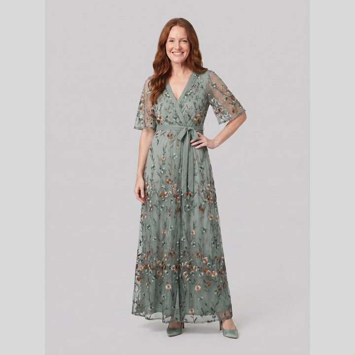 Sage green evening gown with sheer floral embroidery and a V-neck, front view