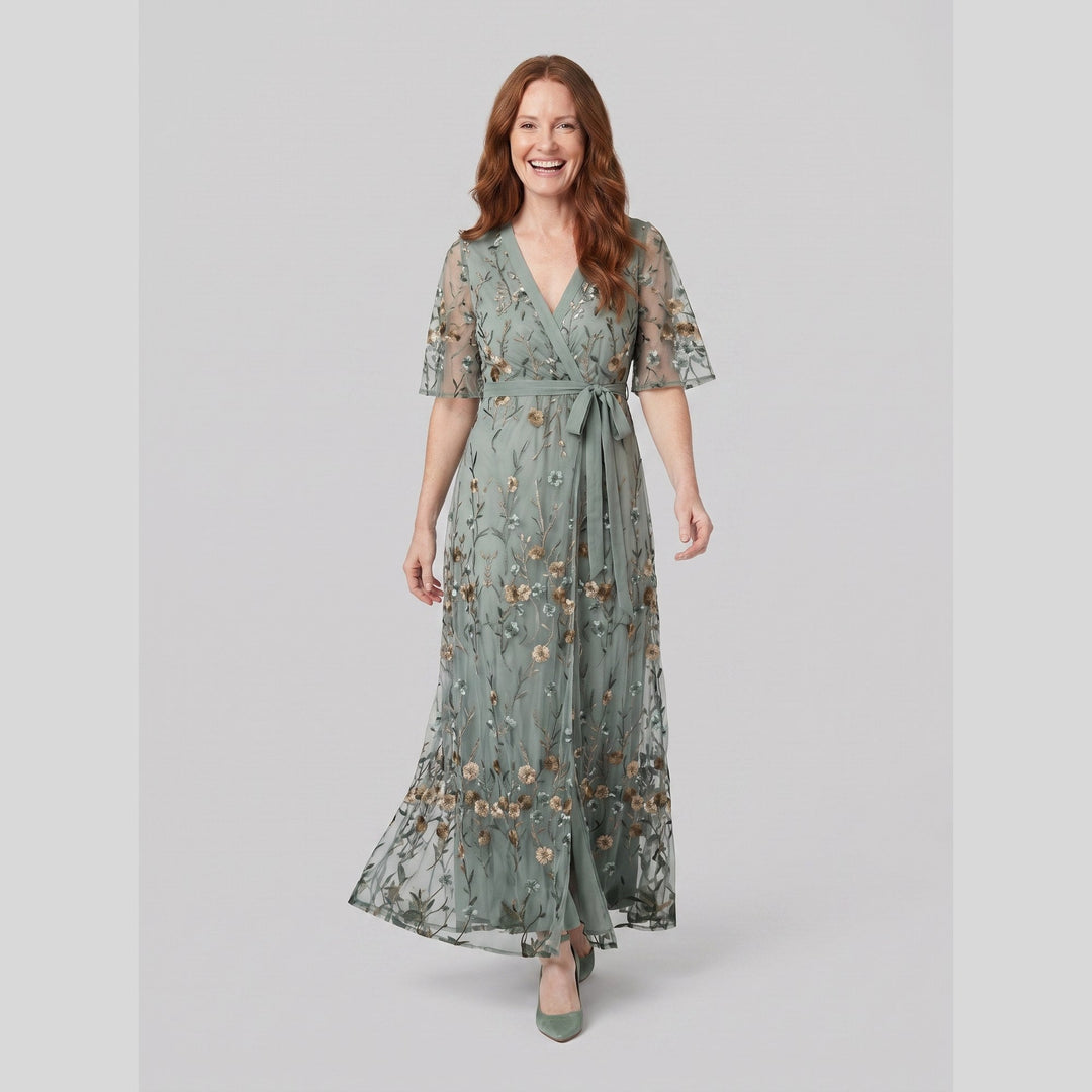 Sage green floral embroidered evening gown in movement on model