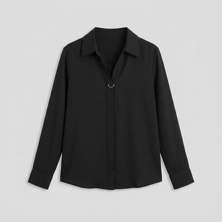 Button-front blouse laid flat, full garment