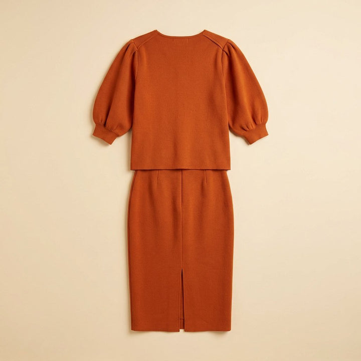 Mira orange puff sleeve set back flat lay