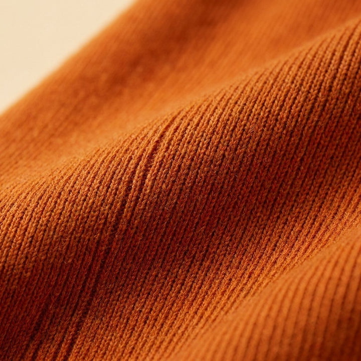 Mira orange knit fabric close up